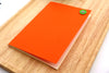 Σημειωματάριο/κουμπί Πορτοκαλί με 40 Chamois cream σελίδες χωρίς γραμμές 10.5x15 εκ.